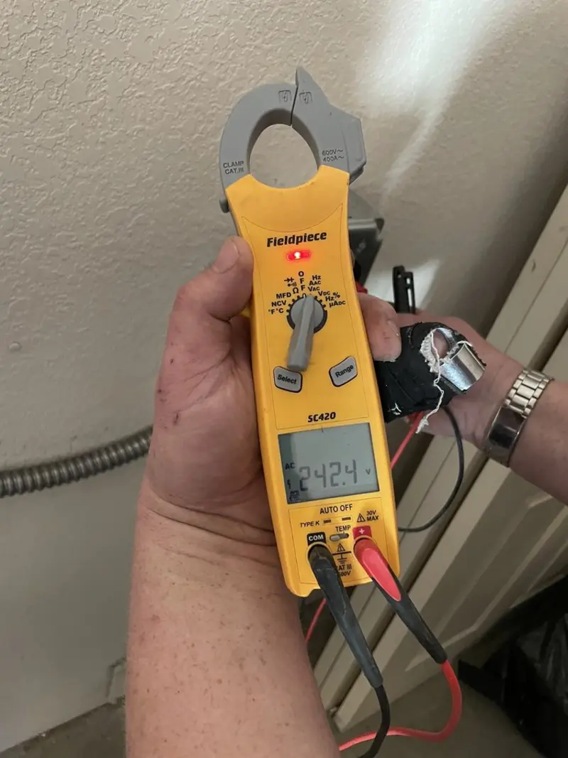 Voltage testing with clamp meter during Electrical Installation Services in Bartow